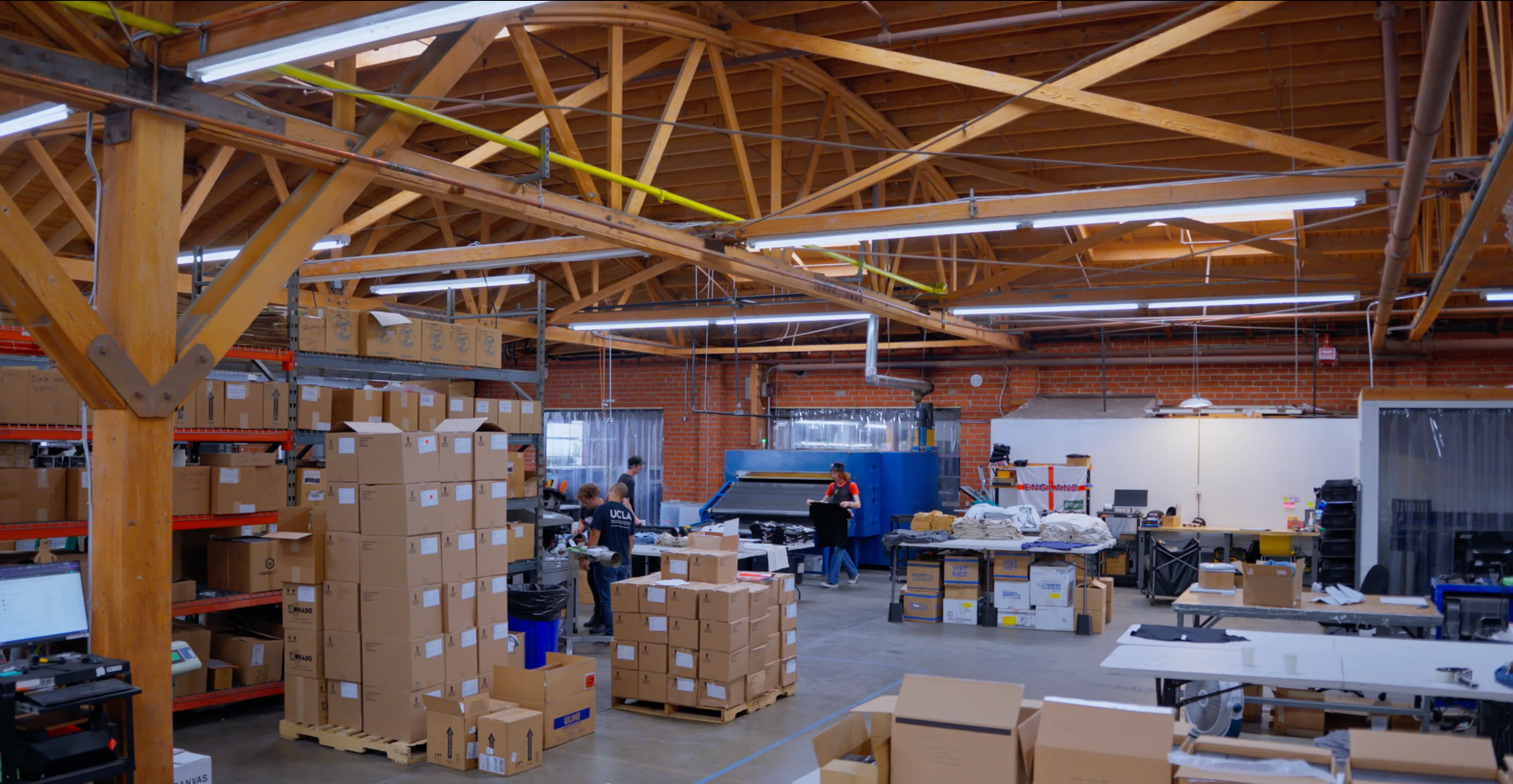 Warehouse team picking, packing and fulfilling orders on a busy fulfillment floor